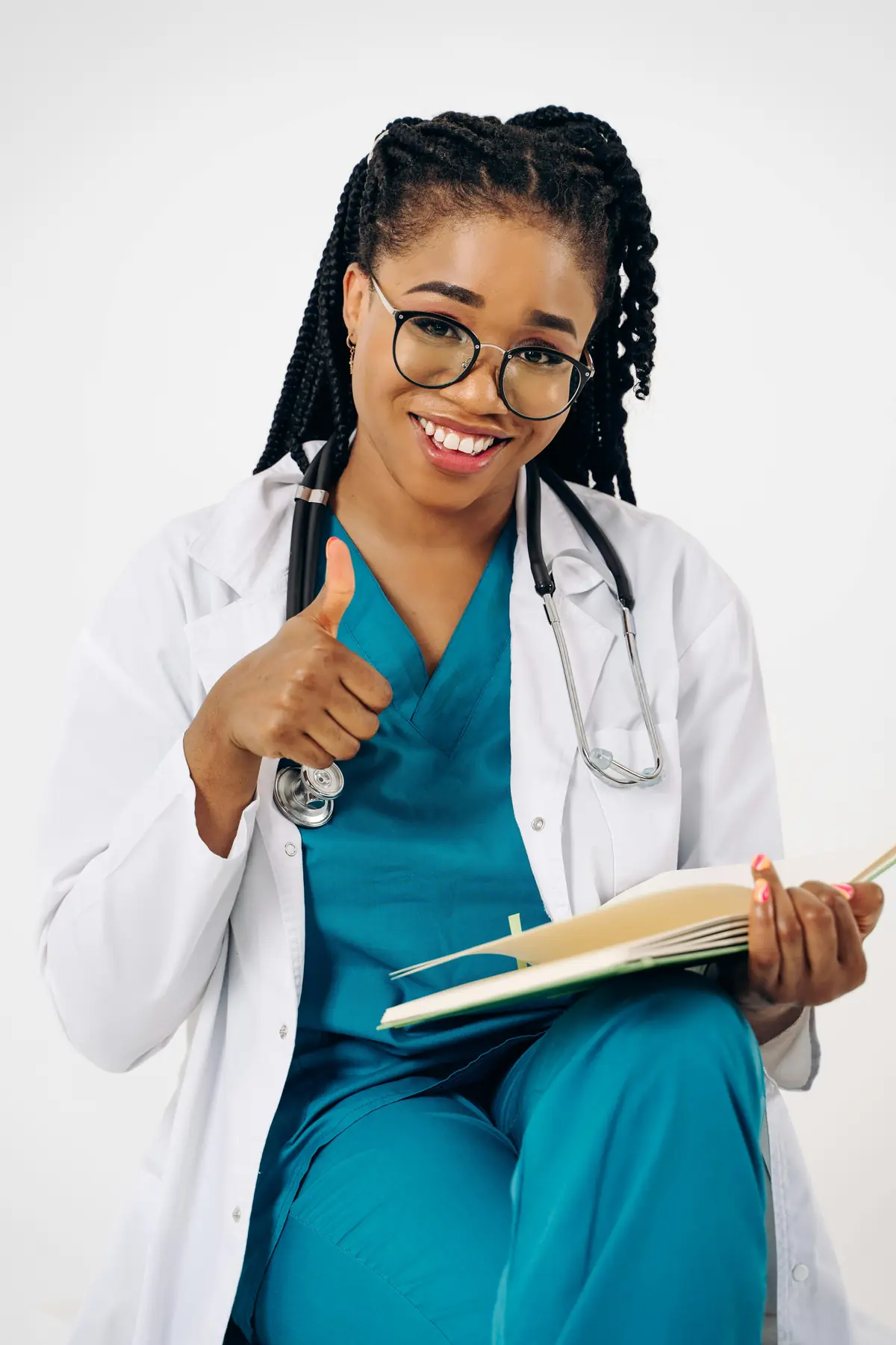 Researcher smiling while holding a notebook